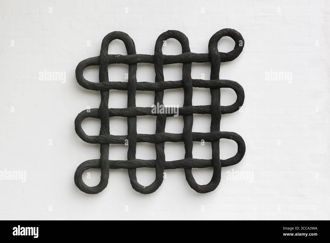 Simbolo del nodo celtico su un muro Foto Stock