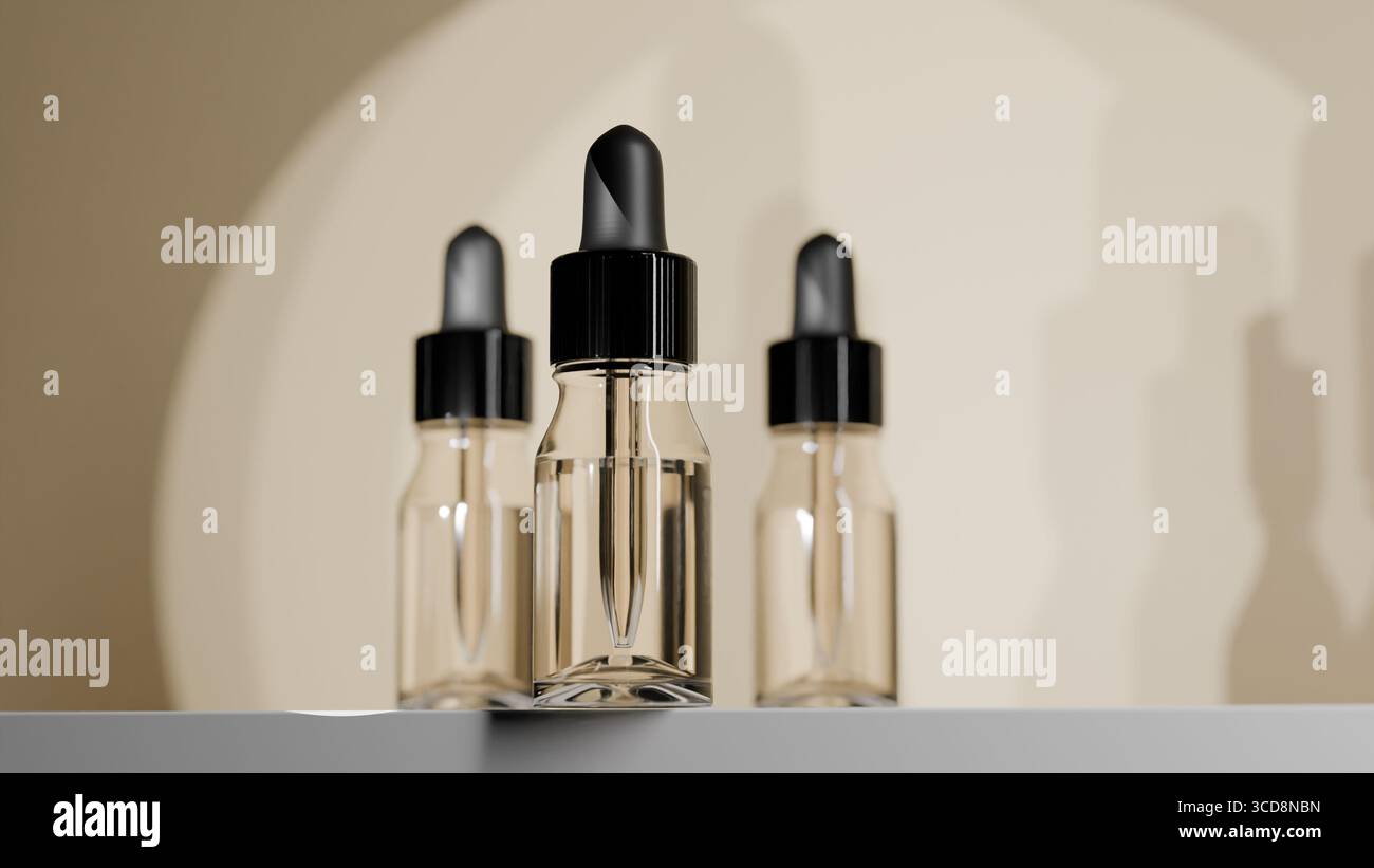 Tre flaconi contagocce in vetro trasparente con tappi neri posizionati insieme su sfondo beige Foto Stock