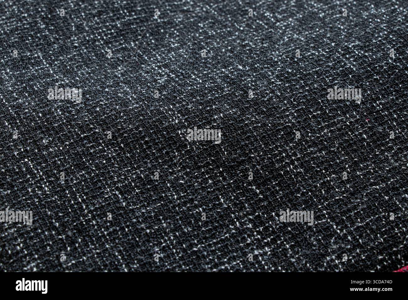 Tessuto nero con fili bianchi intrecciati e grande trama densa per sfondi e texture Foto Stock