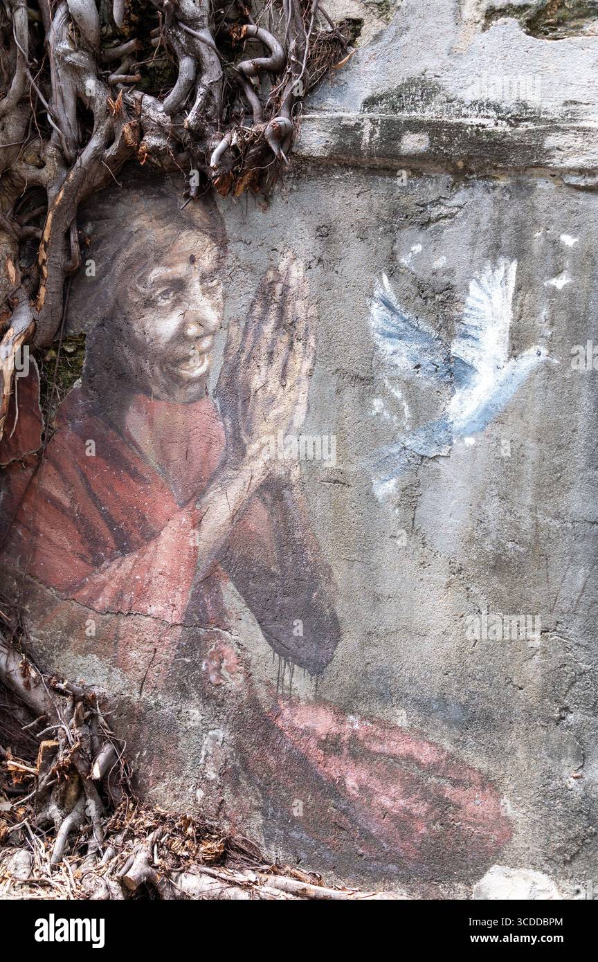 Un murale di una «Signora indiana di preghiera» dell’artista russa Julia Volchkova su Lorong Lumut a George Town, una città di Penang in Malesia, quasi alla vigilia Foto Stock