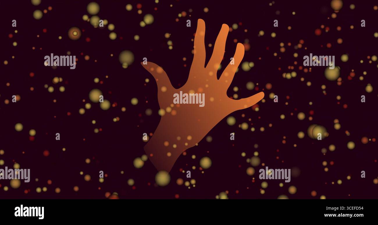 Immagine di macchie arancioni e mano su sfondo nero Foto Stock