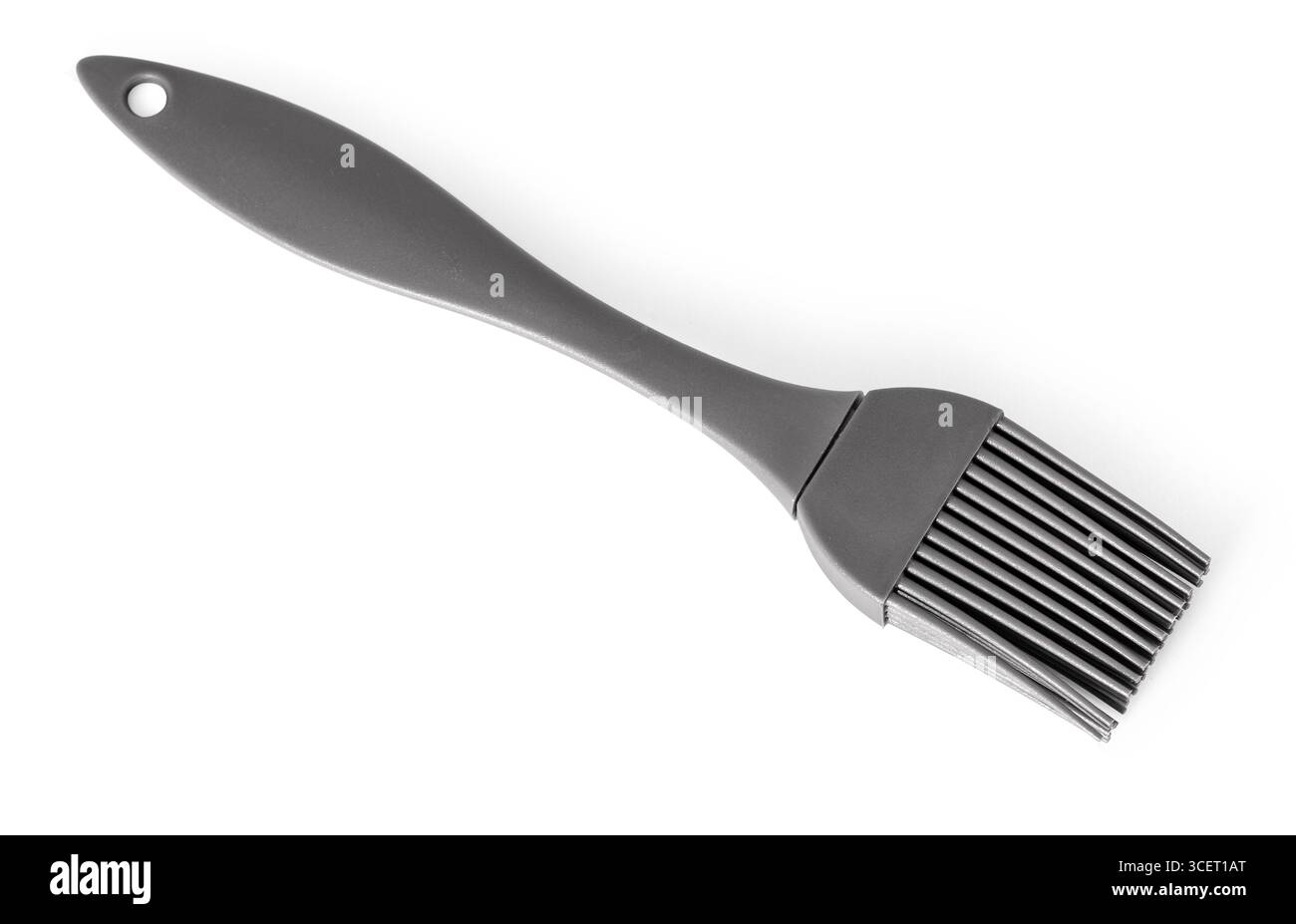 Spazzola per pasticceria grigia in silicone su sfondo bianco, ideale per ingrassare teglie da forno o applicare smalti Foto Stock
