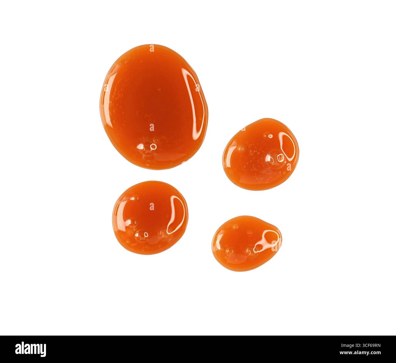 Gocce di caramello fuso, sciroppo isolato sul bianco, percorso di ritaglio, vista dall'alto Foto Stock