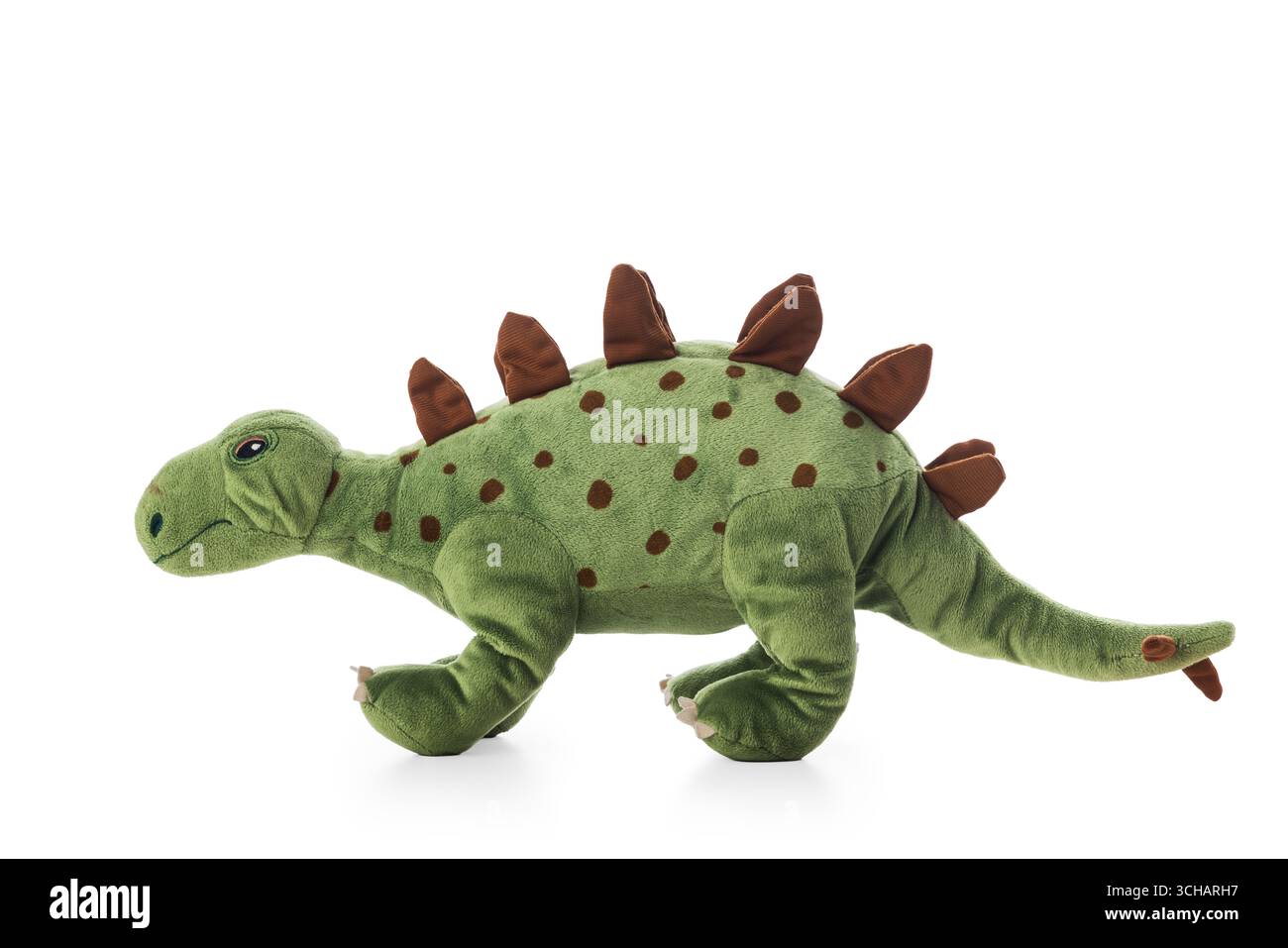 Peluche dinosauro in un vivace colore verde isolato su sfondo bianco Foto Stock Peluche dinosauro in un vivace colore verde isolato su sfondo bianco Foto Stock