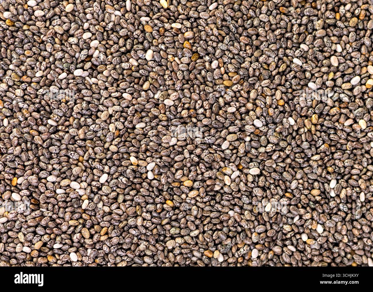 supplemento semi di chia per il benessere e benefici per la salute, top down shot in macro ideale per lo sfondo Foto Stock