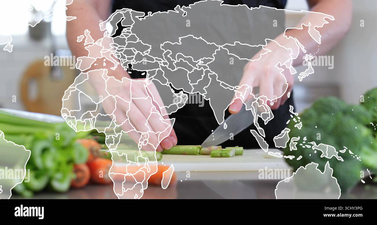 Affettare le mani di un adulto indossando un grembiule scuro per tritare gli asparagi sul tagliere, con sovrapposizione della mappa mondiale Foto Stock