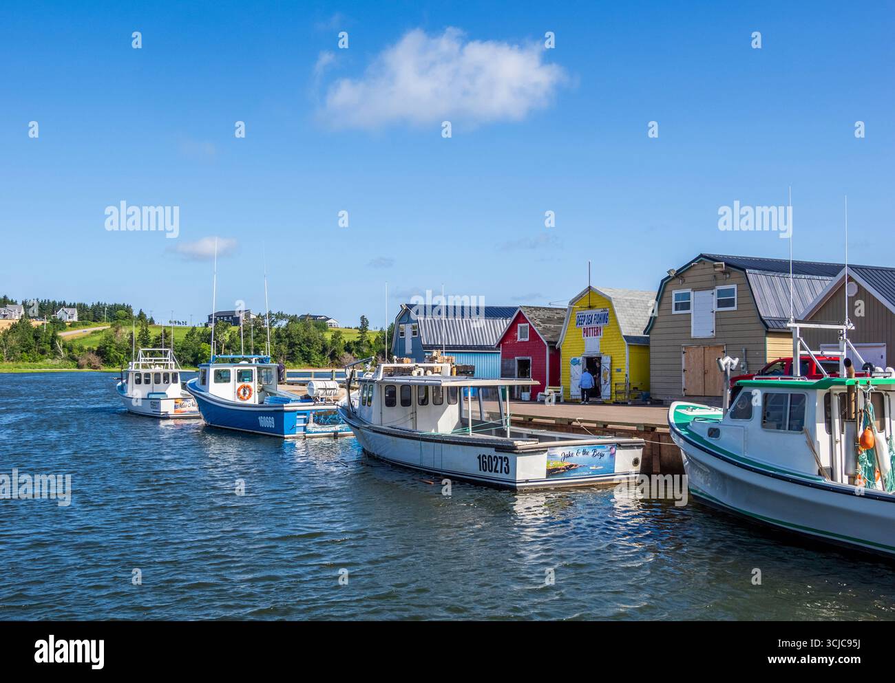 Barche da pesca al New London Wharf sull'Isola del Principe Edoardo in Canada Foto Stock