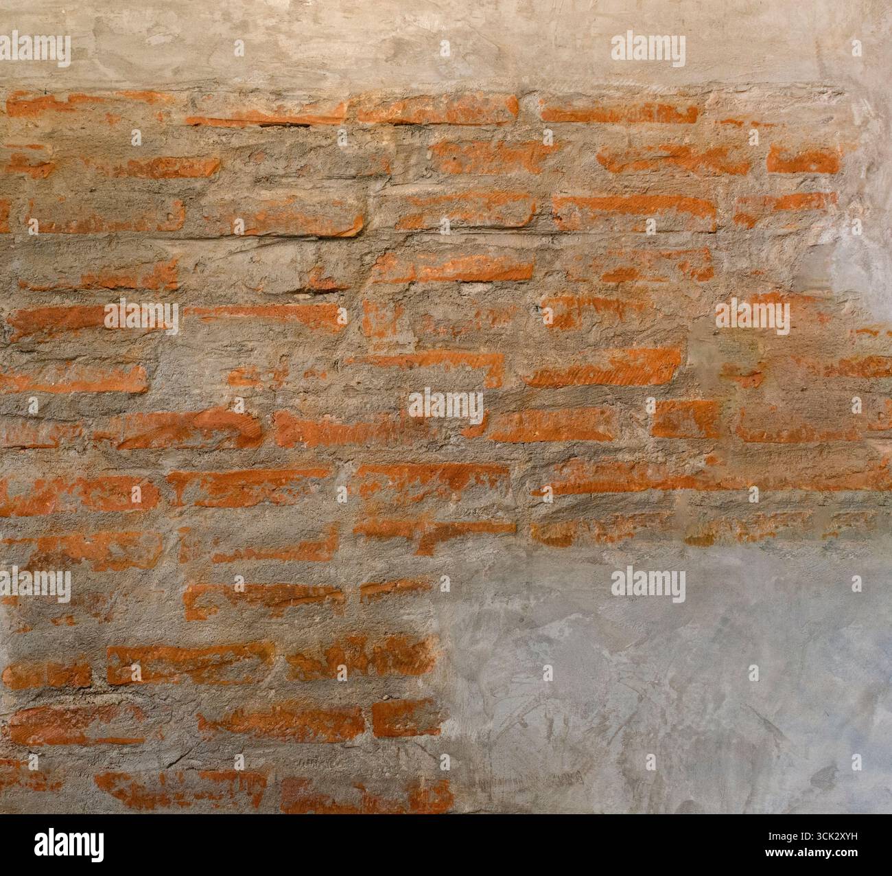 Mattoni vecchi in cemento su sfondo a trama murale. Foto Stock