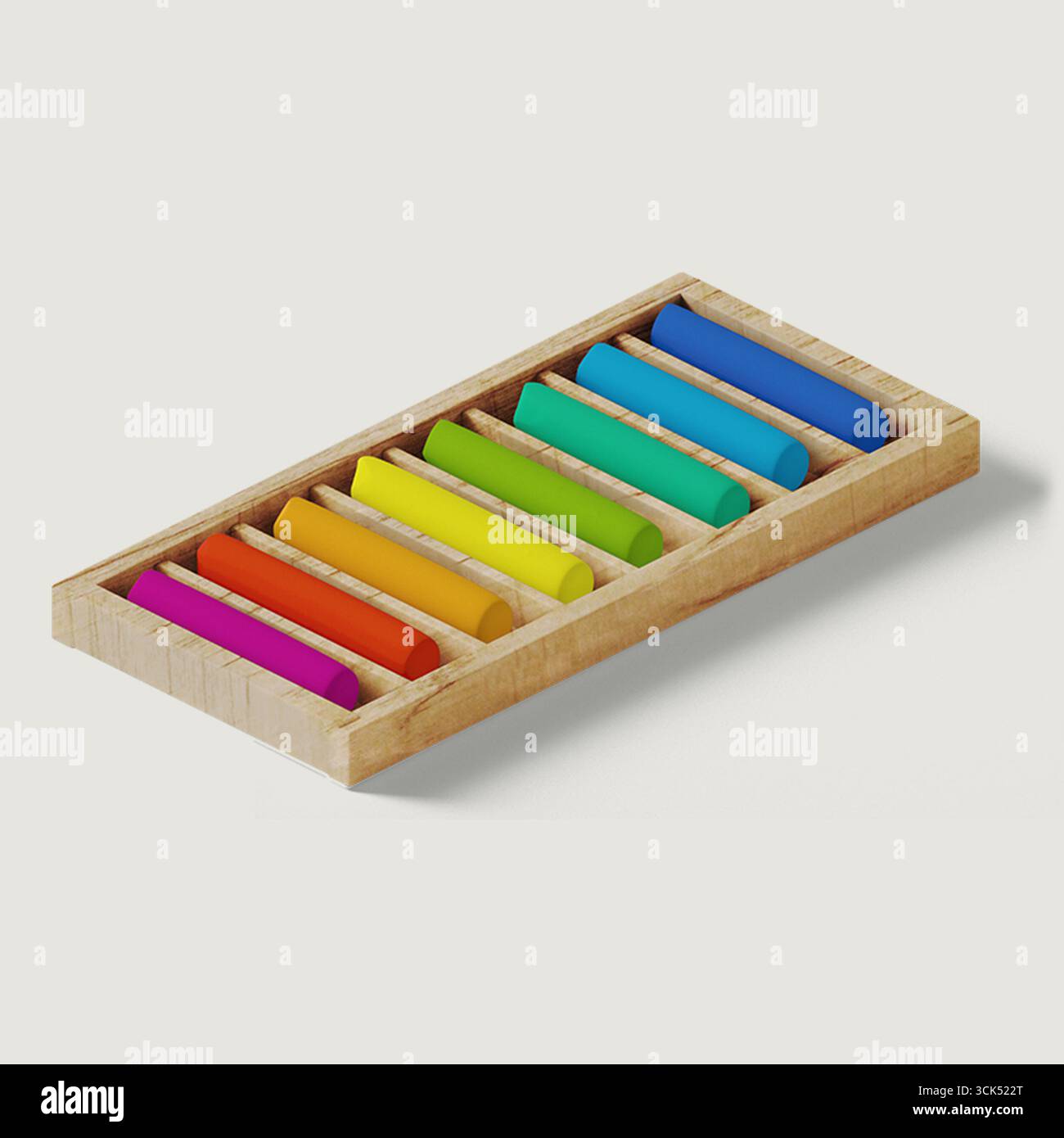 Una scatola di legno contenente colorati bastoncini di gesso disposti in una fila ordinata, ideale per progetti artistici e creativi. Foto Stock