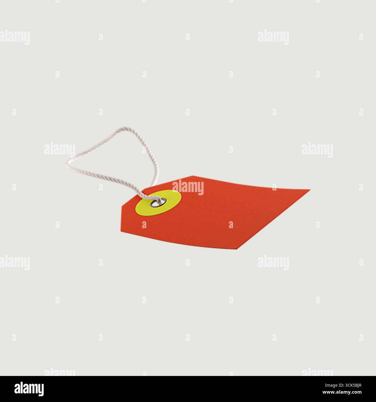 Un'etichetta rossa con un cerchio giallo, progettata per l'etichettatura o il prezzo degli articoli. Foto Stock