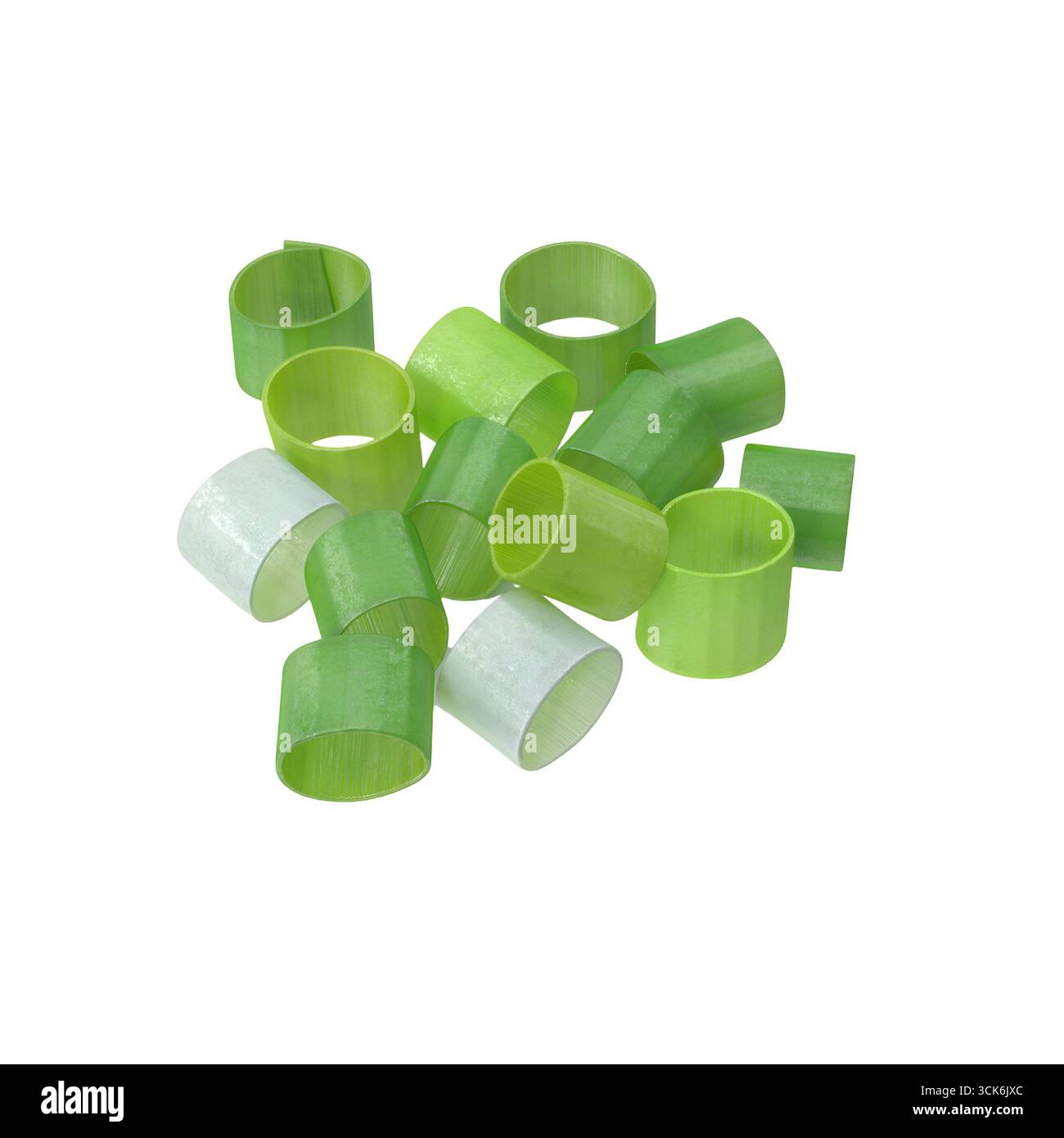 Una collezione di forme cilindriche verdi e traslucide, che assomigliano a oggetti decorativi per alimenti o materiali di lavorazione. Foto Stock