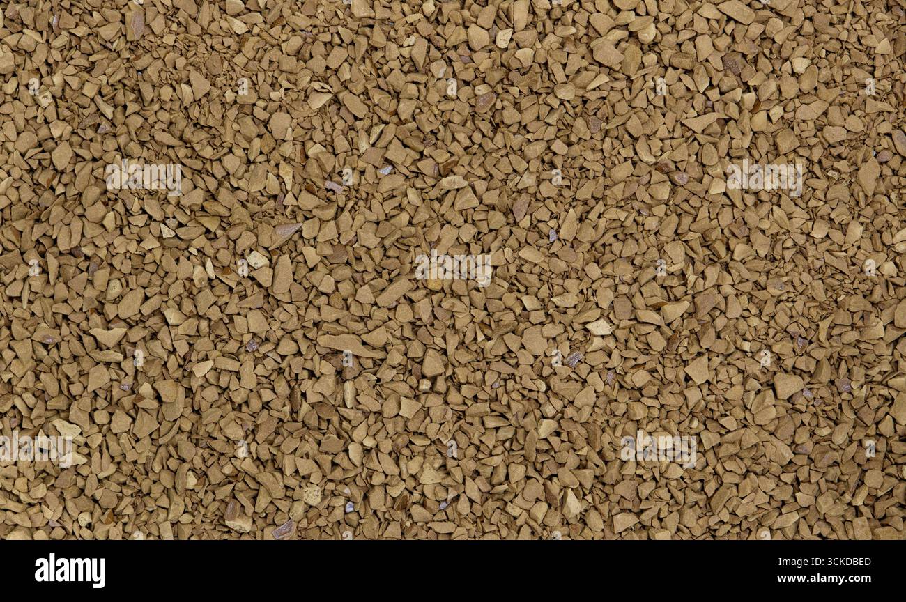 Bevanda a base di caffè istantaneo macchie grosse di caffeina fondo marrone liofilizzato. Foto Stock