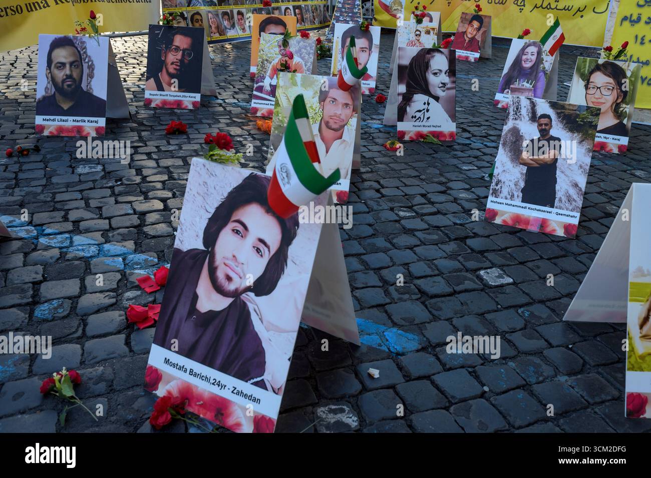 Roma, Italia. 13 settembre 2025. Foto di alcune delle vittime giustiziate in Iran durante il sit-in per commemorare la morte di Mahsa Amini e di tutte le ''˜vittime del regime iraniano' organizzato dal Consiglio Nazionale di resistenza dell'Iran (NCRI) a Roma.l'NCRI è un'organizzazione politica fondata nel 1981, legata al Partito Mojahedin del popolo anti-teocratico dell'Iran (PMOI). Si descrive come un'ampia coalizione di cinque organizzazioni e partiti di opposizione. Il diplomatico iraniano Maryam Rajavi è il presidente dell'NCRI. (Credit Image: © Marcello Valeri/ZUMA Press Wire) SOLO PER USO EDITORIALE! No Foto Stock