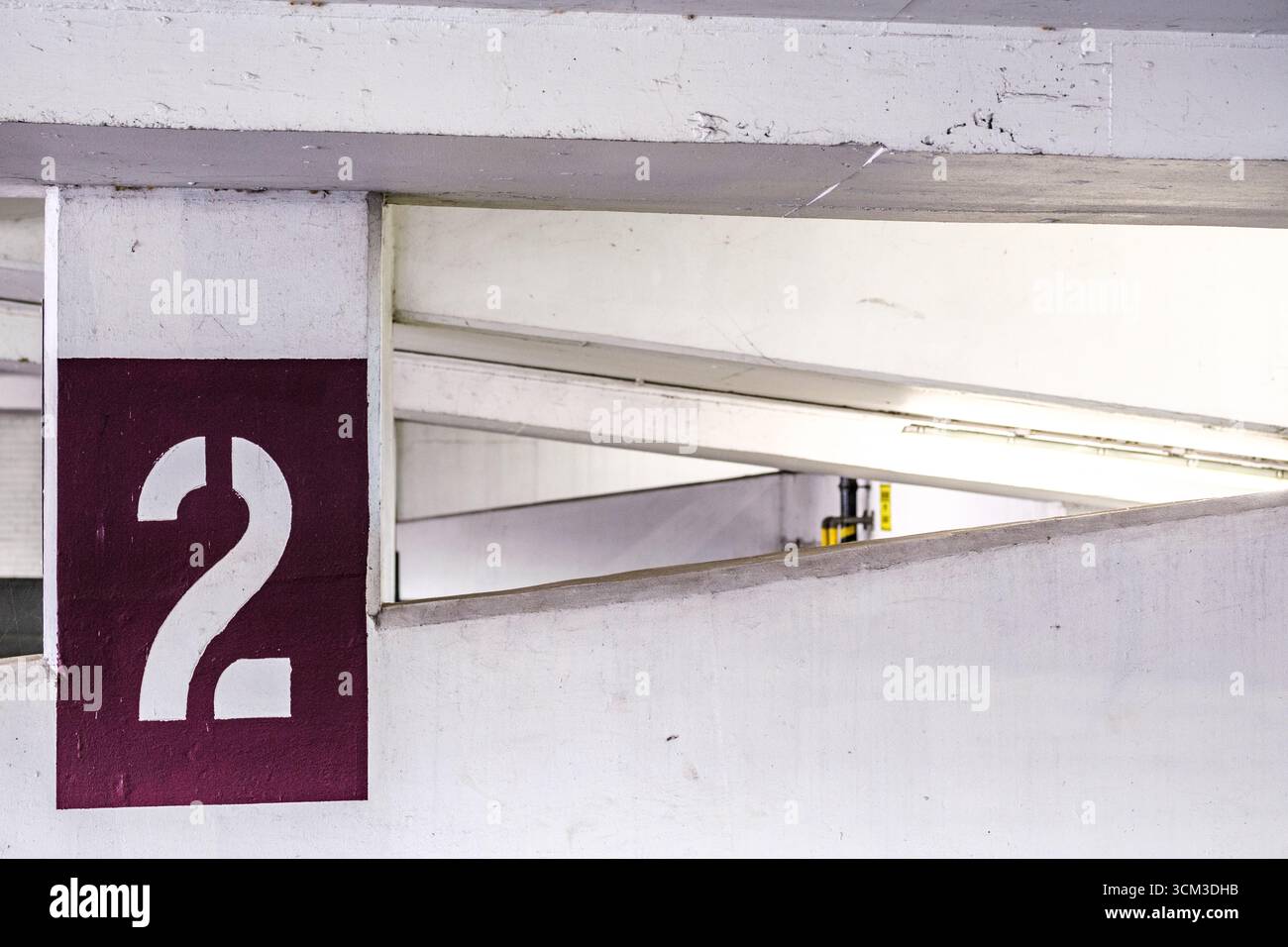 Londra Regno Unito, 14 settembre 2025, A Painted Isolated Graphic Number Two Inside A Publiic Car Park Foto Stock