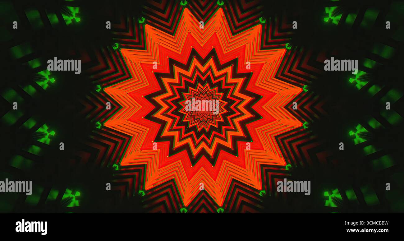Le forme a forma di stella rossa e verde brillante formano un design complesso su uno sfondo scuro. I colori vivaci creano un effetto visivo straordinario, catturando l'attenzione Foto Stock