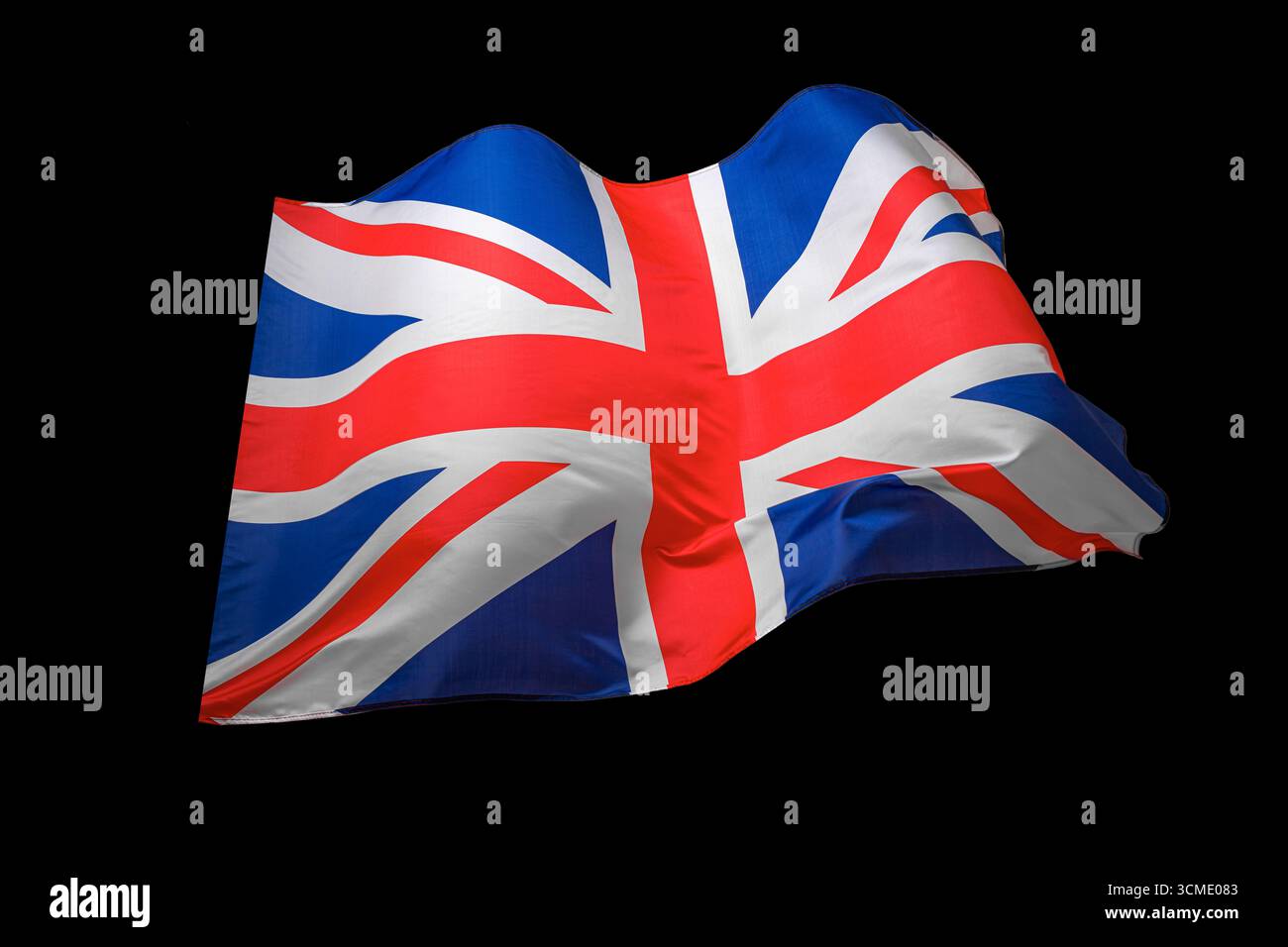 Bandiera del Regno Unito Union Jack che sventola su uno sfondo scuro Foto Stock