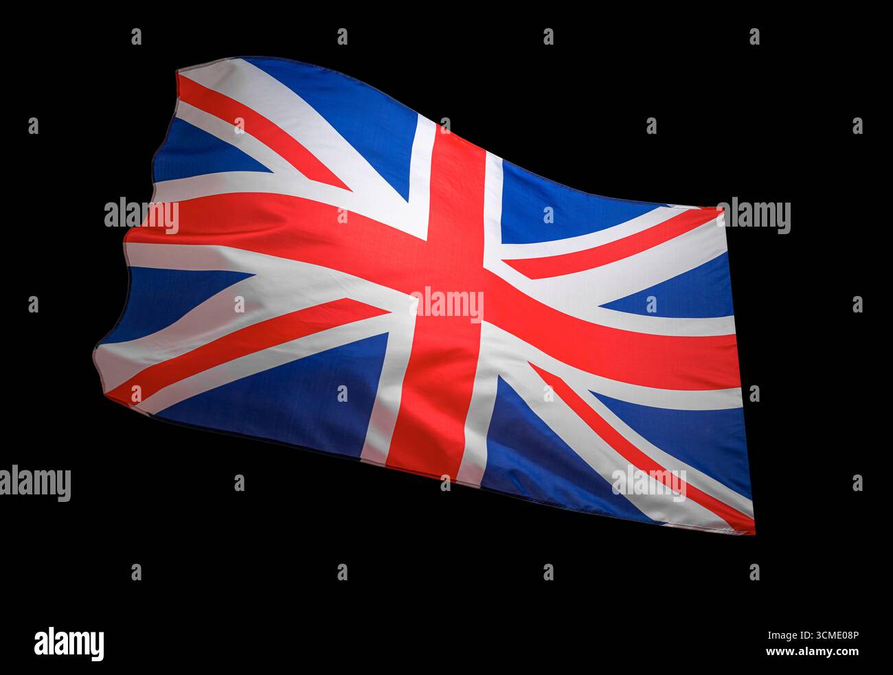Bandiera del Regno Unito Union Jack che sventola su uno sfondo scuro Foto Stock
