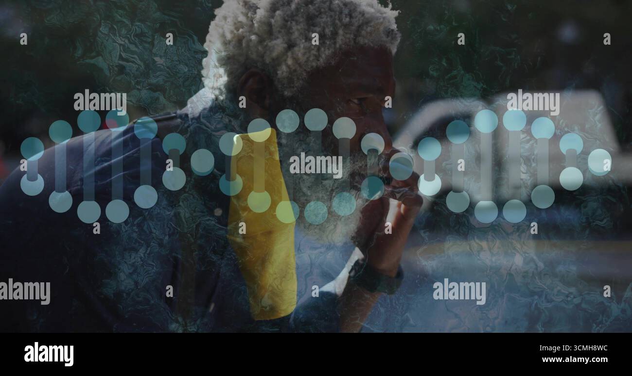 Tenendo il boccaglio alle labbra, uomo afroamericano appoggiato alla finestra, con un asciugamano giallo e un'elica del DNA Foto Stock