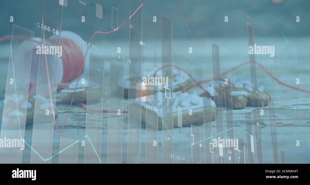 Mostra il rotolo di filo rosso accanto ai pasticcini che spruzzano la glassa bianca sul tavolo di legno con grafici finanziari Foto Stock