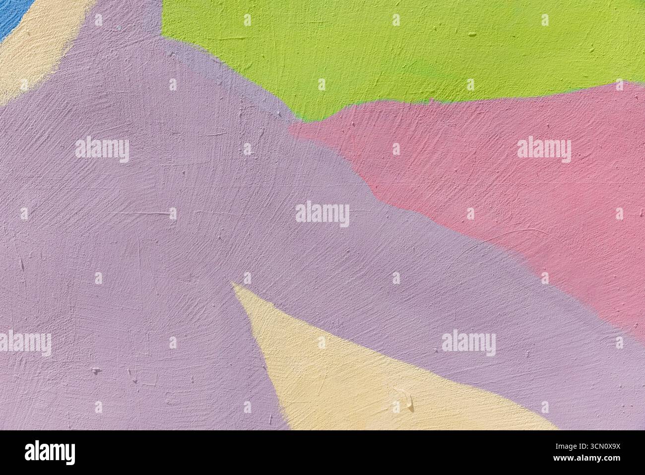 Colorato motivo astratto che mostra una parete testurizzata dipinta con vivaci sfumature pastello, tra cui rosa, verde, giallo e viola, trasporto artistico c Foto Stock