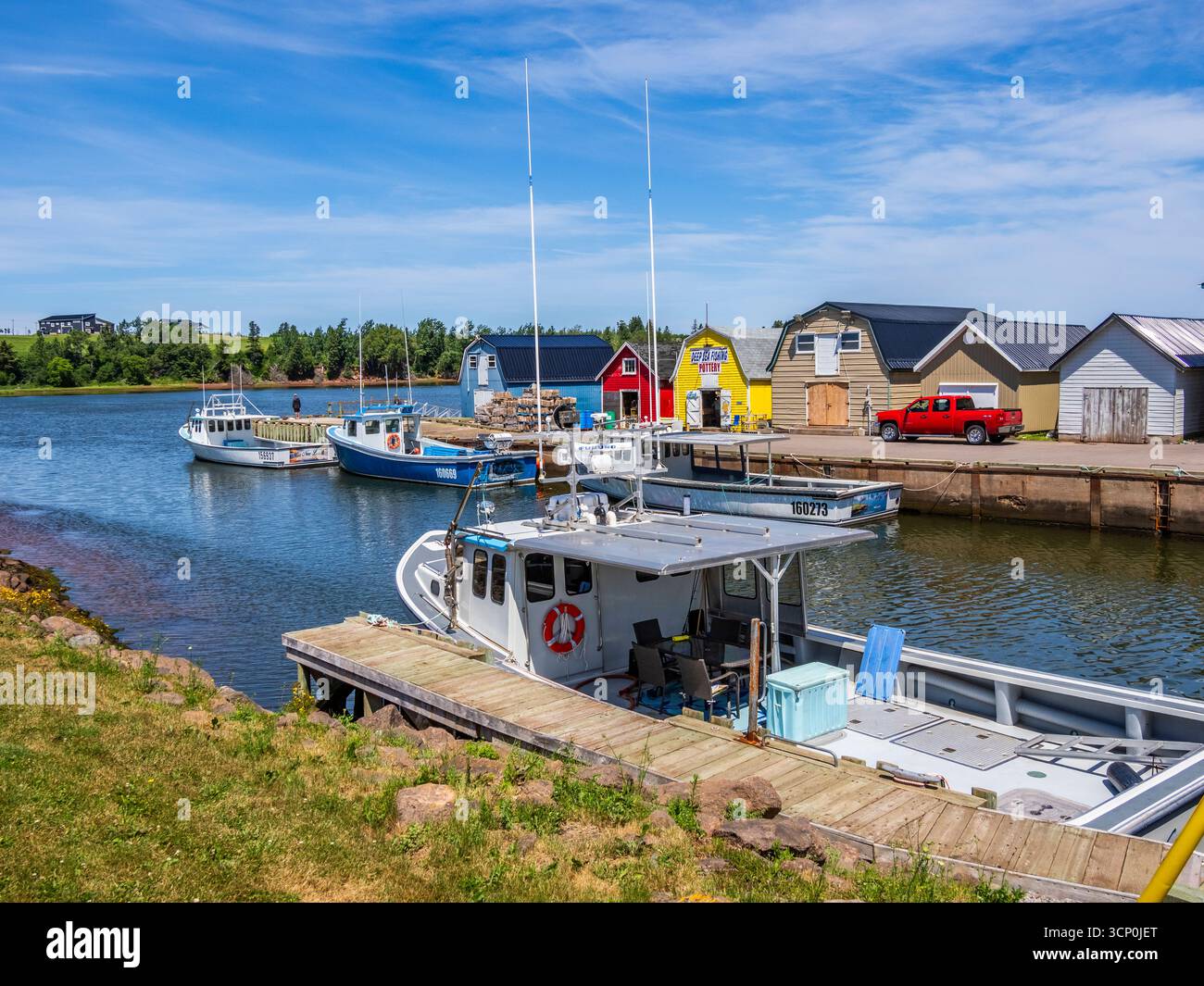 Barche da pesca al New London Wharf sull'Isola del Principe Edoardo in Canada Foto Stock