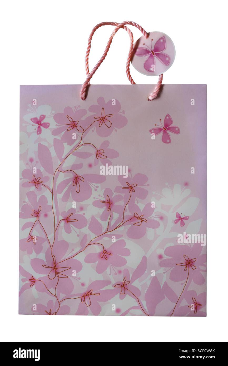 borsa regalo rosa fiorita con etichetta regalo abbinata isolata su sfondo bianco Foto Stock