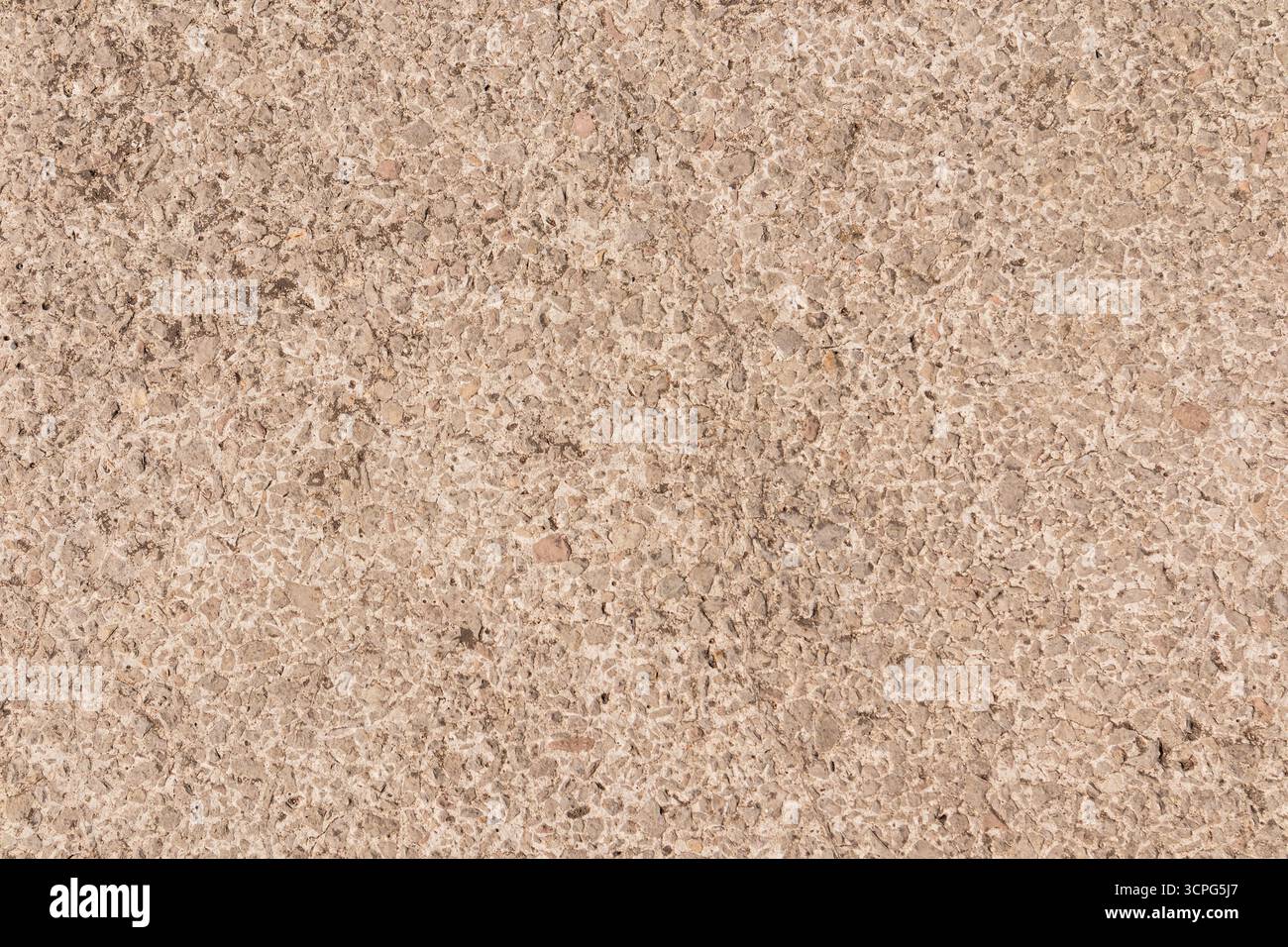 Splendido sfondo di materiali da costruzione di colore beige, miscela di materiali sfusi per superfici stradali urbane. vista dall'alto. Uno spazio di copia. Un mockup, una texture campione Foto Stock