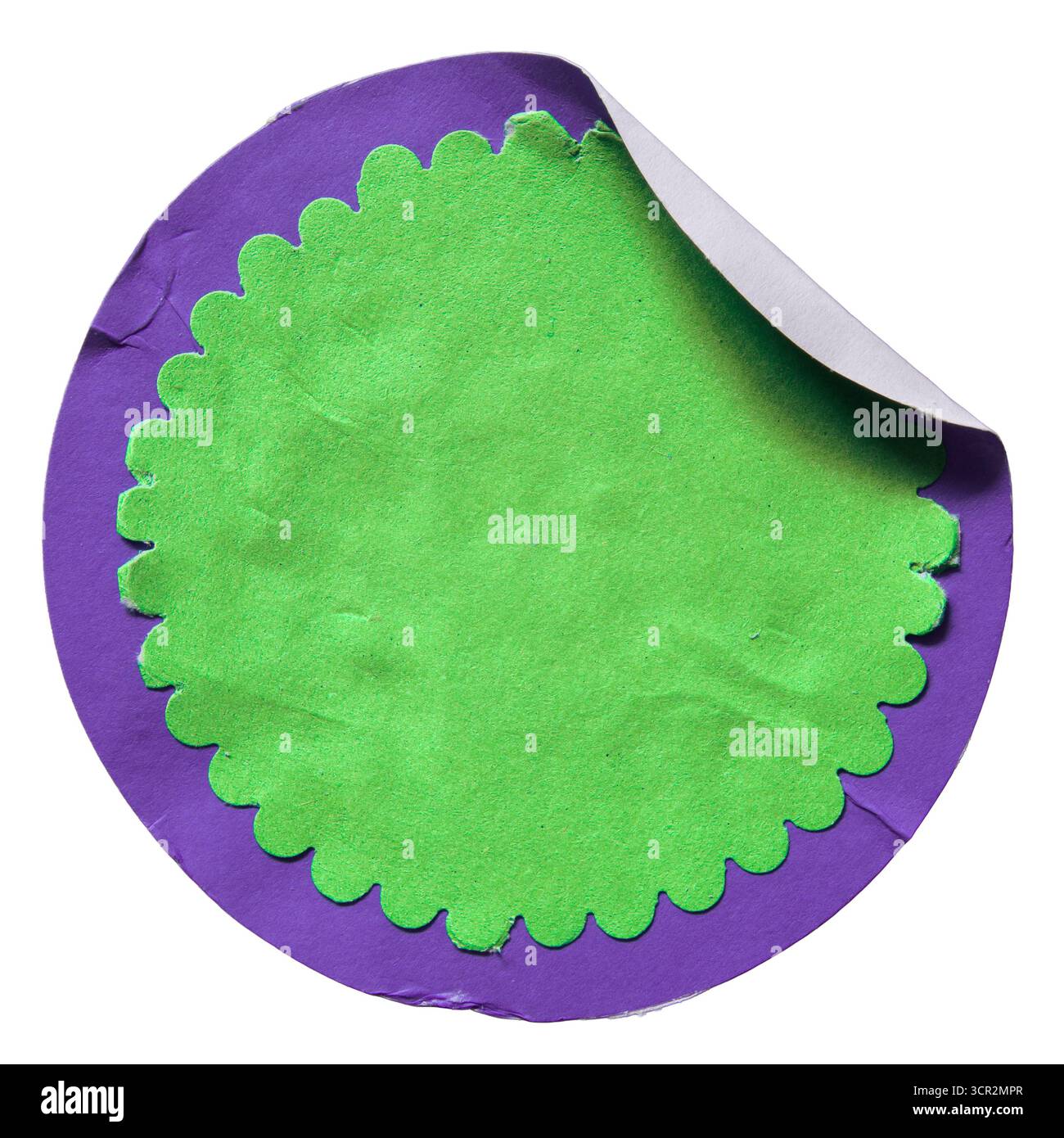 Un adesivo di carta con cartellino del prezzo di vendita con un cerchio viola e un cerchio verde con bordo ondulato all'interno. Foto Stock