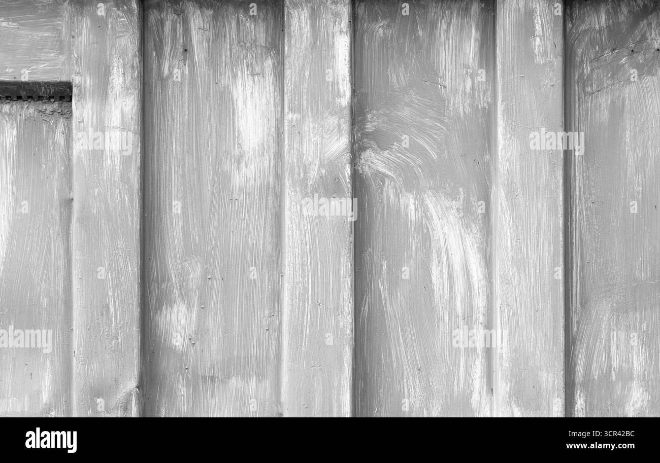 Vista ravvicinata della superficie in metallo verniciato grigio, con tratti e texture visibili. Perfetto per progetti di progettazione o come sfondo Foto Stock