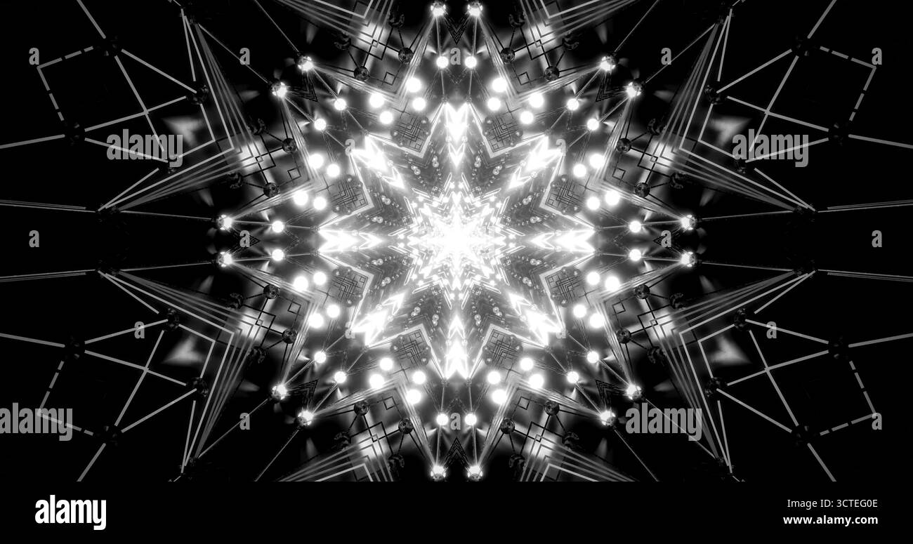 I fasci di luce creano un complesso design simile a una stella, circondato da un sorprendente motivo geometrico. La scena combina sfumature scure con luci luminose, s. Foto Stock