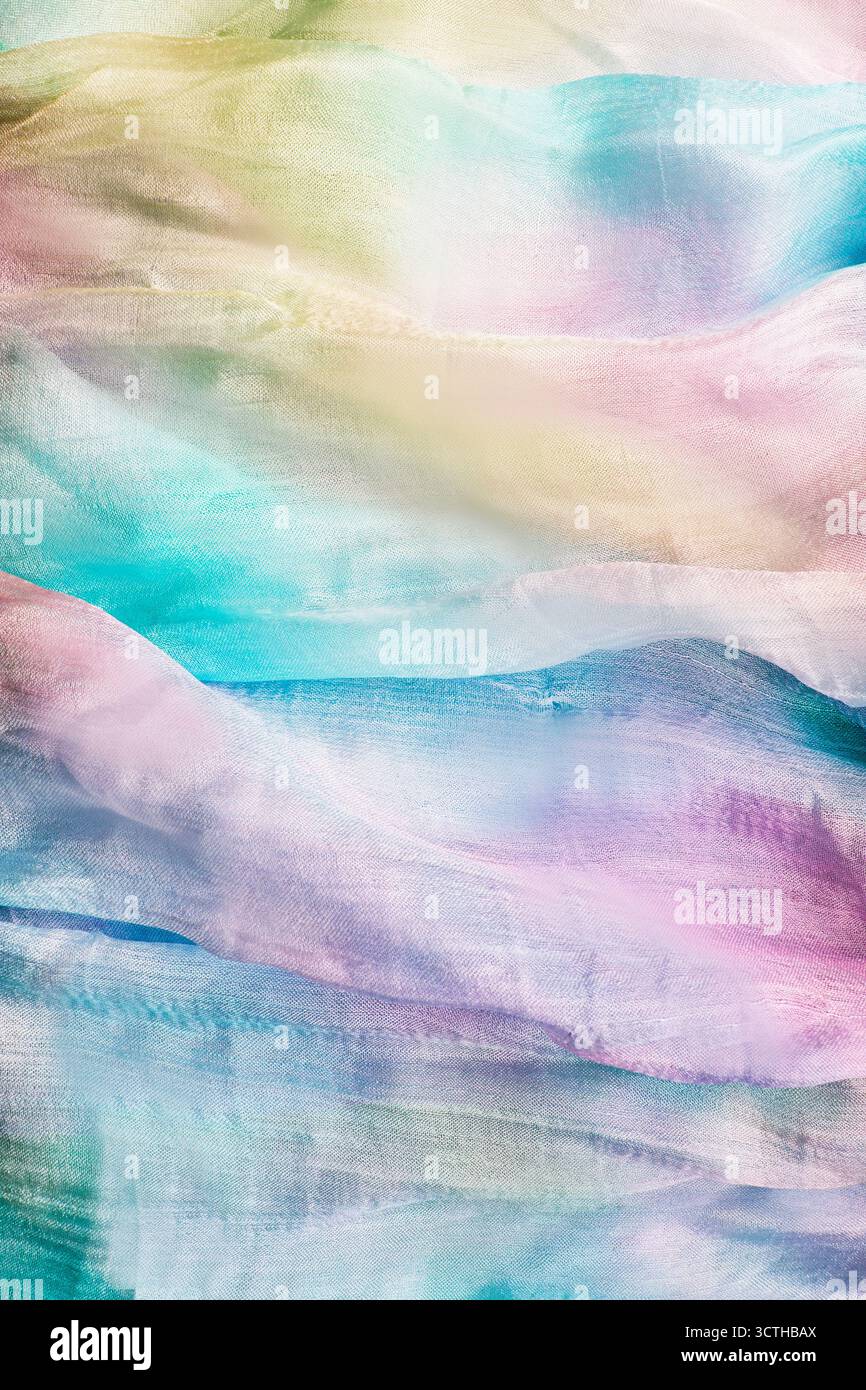 Primo piano in colorato tessuto di seta pastello come sfondo astratto Foto Stock