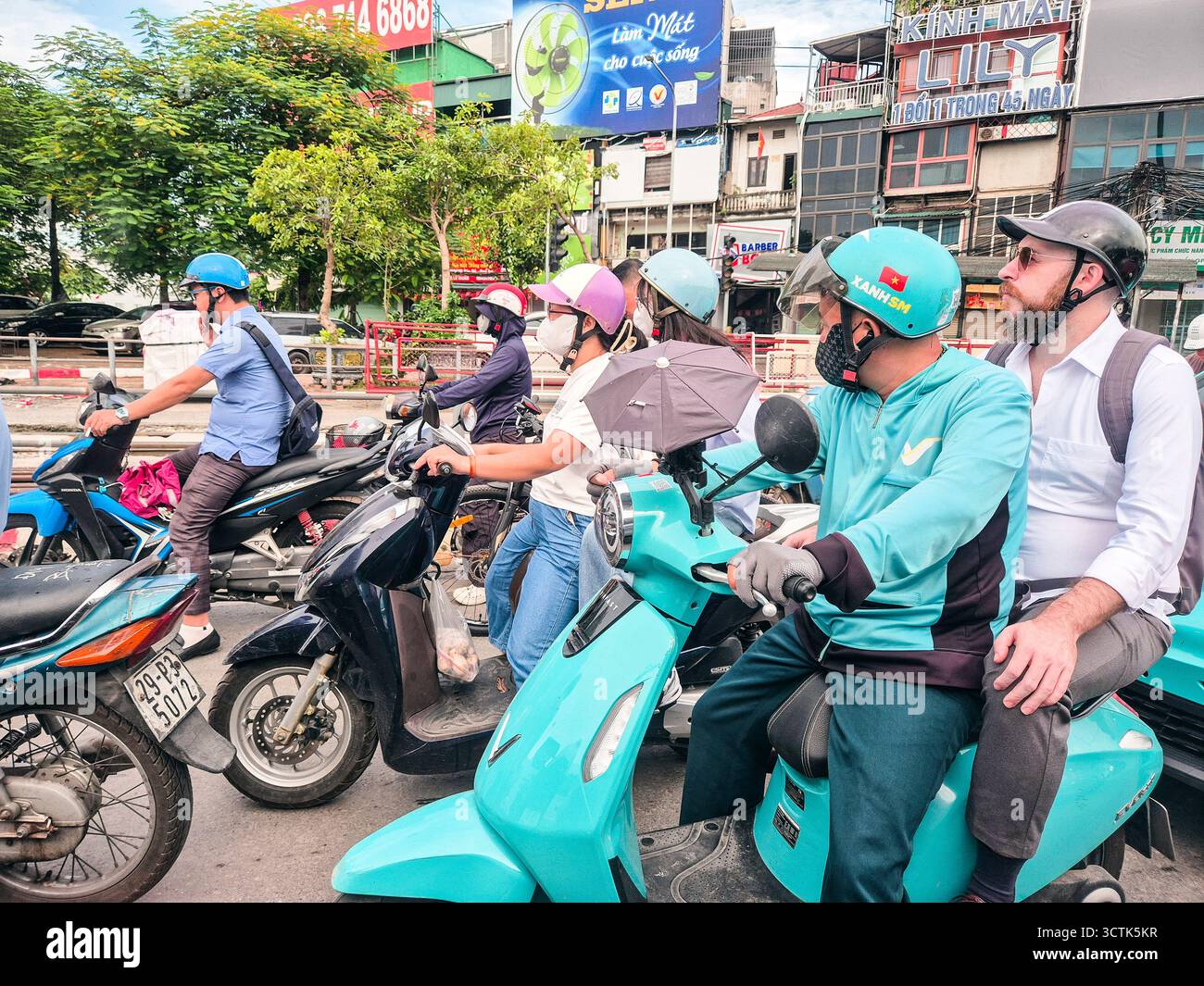 Vietnam, Hanoi, Vinfast moto taxi Foto Stock