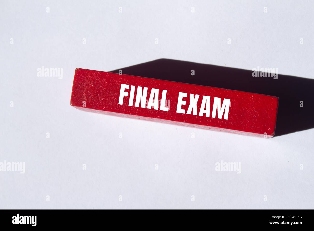 Final exam message written on wooden block background. Conceptual Final exam symbol. Copy space. Foto Stock