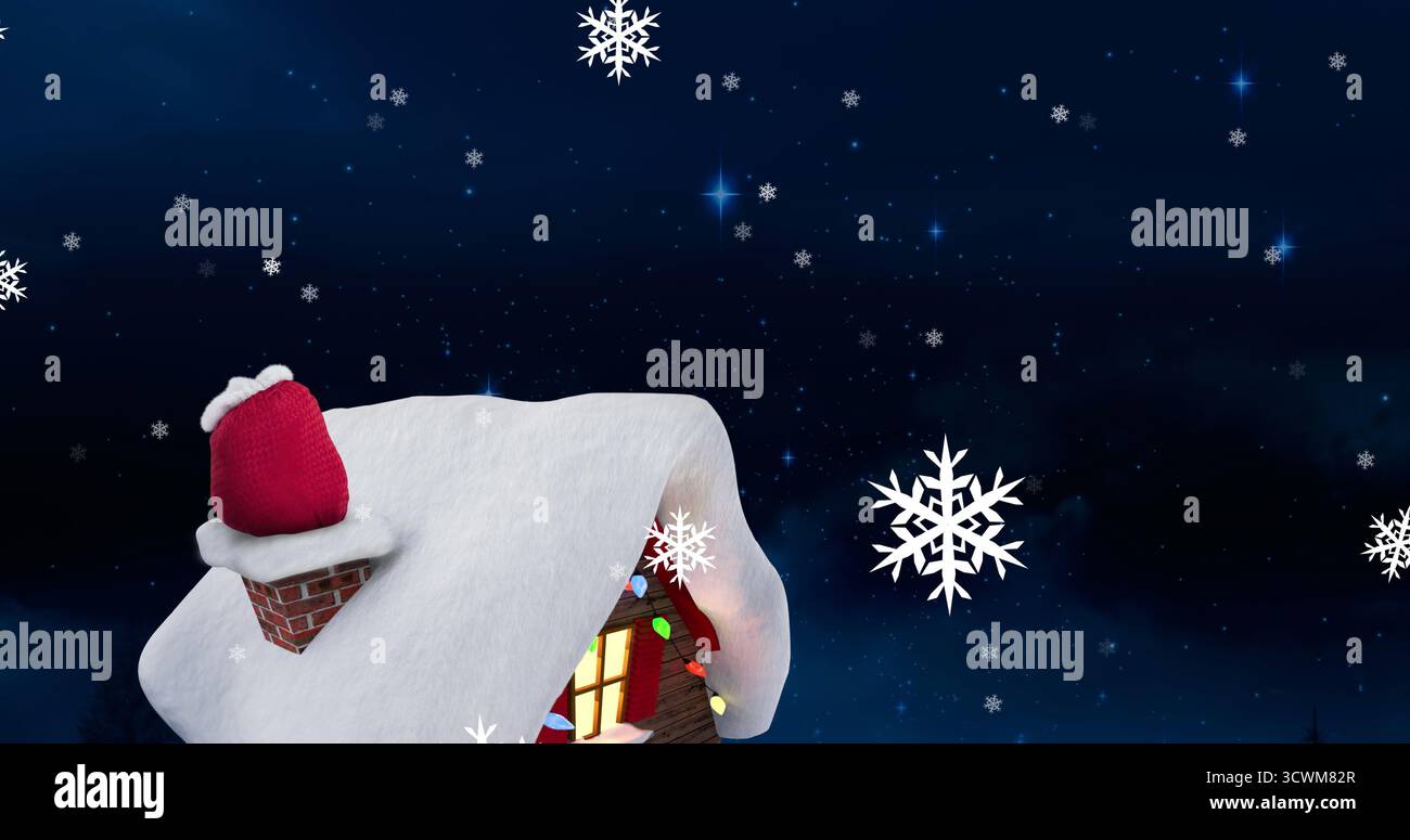 Fiocchi di neve che cadono sopra una casa coperta di neve contro stelle blu brillanti nel cielo notturno Foto Stock