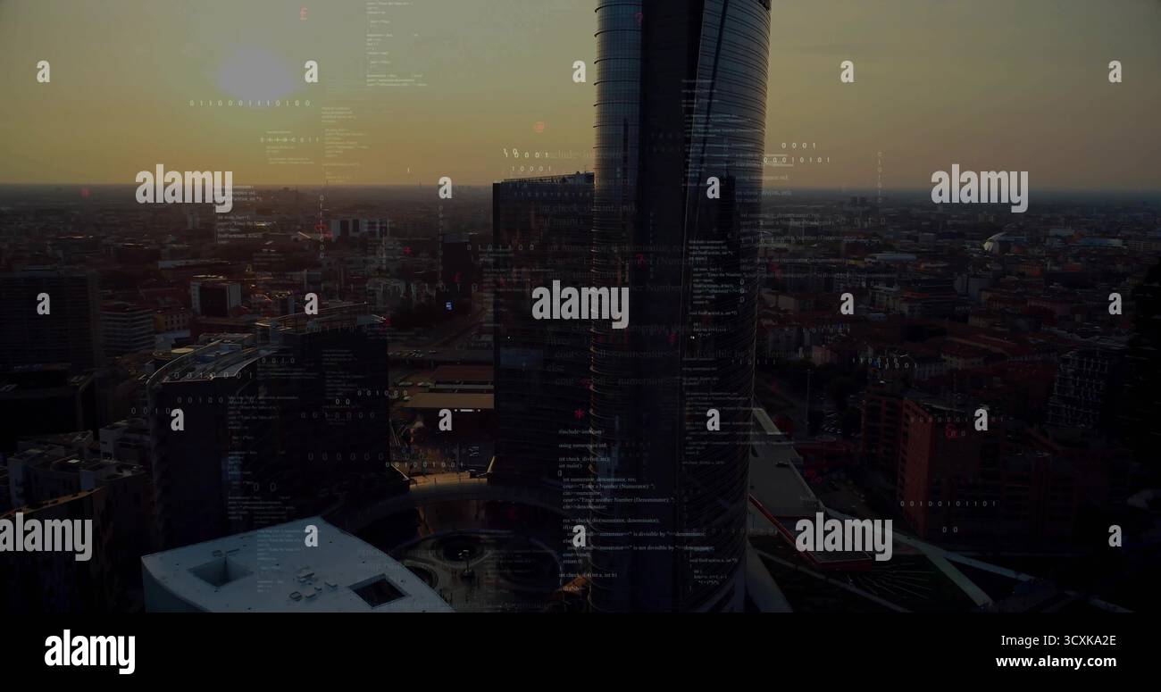 Due torri cilindriche in vetro che brillano nello skyline del tramonto, con griglia stradale illuminata e sovrapposizioni di codici Foto Stock