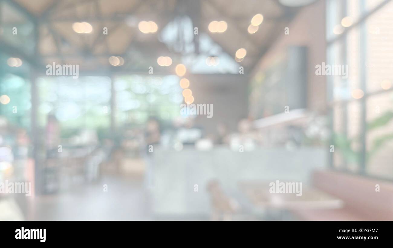 Immagine orizzontale e ultra morbida che cattura l'ambiente luminoso del bar o lounge alla moda. Luminosità e una coll. Lavata deliberata con perdite di luce Foto Stock