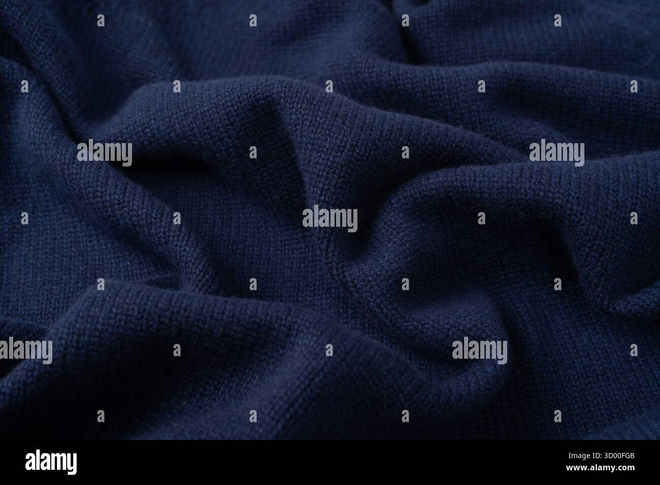 Maglia blu navy in lana merino come sfondo. Vista dall'alto. Foto Stock