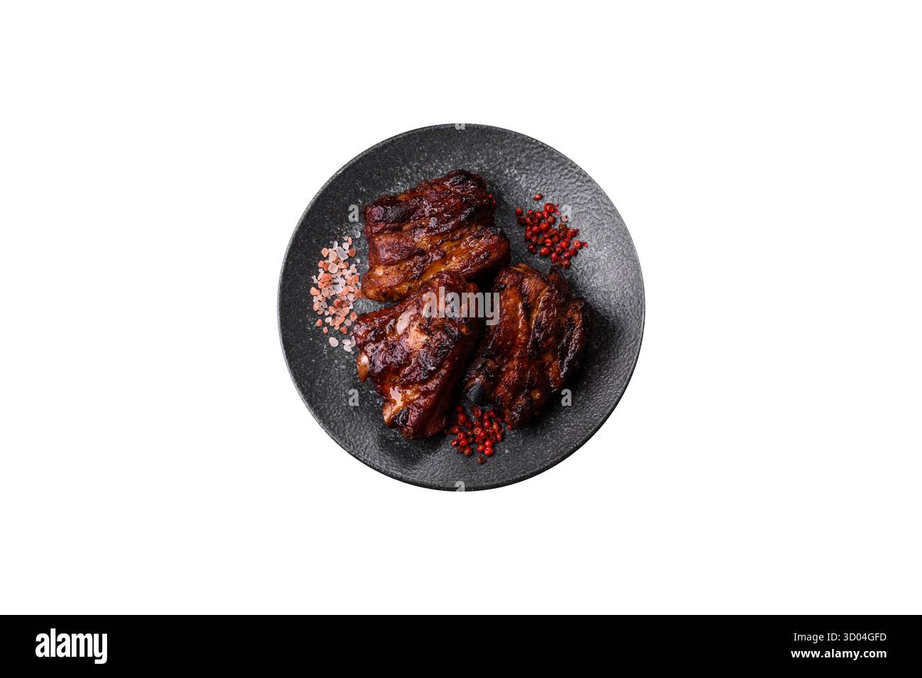 Costolette di maiale grigliate o grigliate con salsa. Costolette grigliate come sfondo per il tuo design. Foto Stock