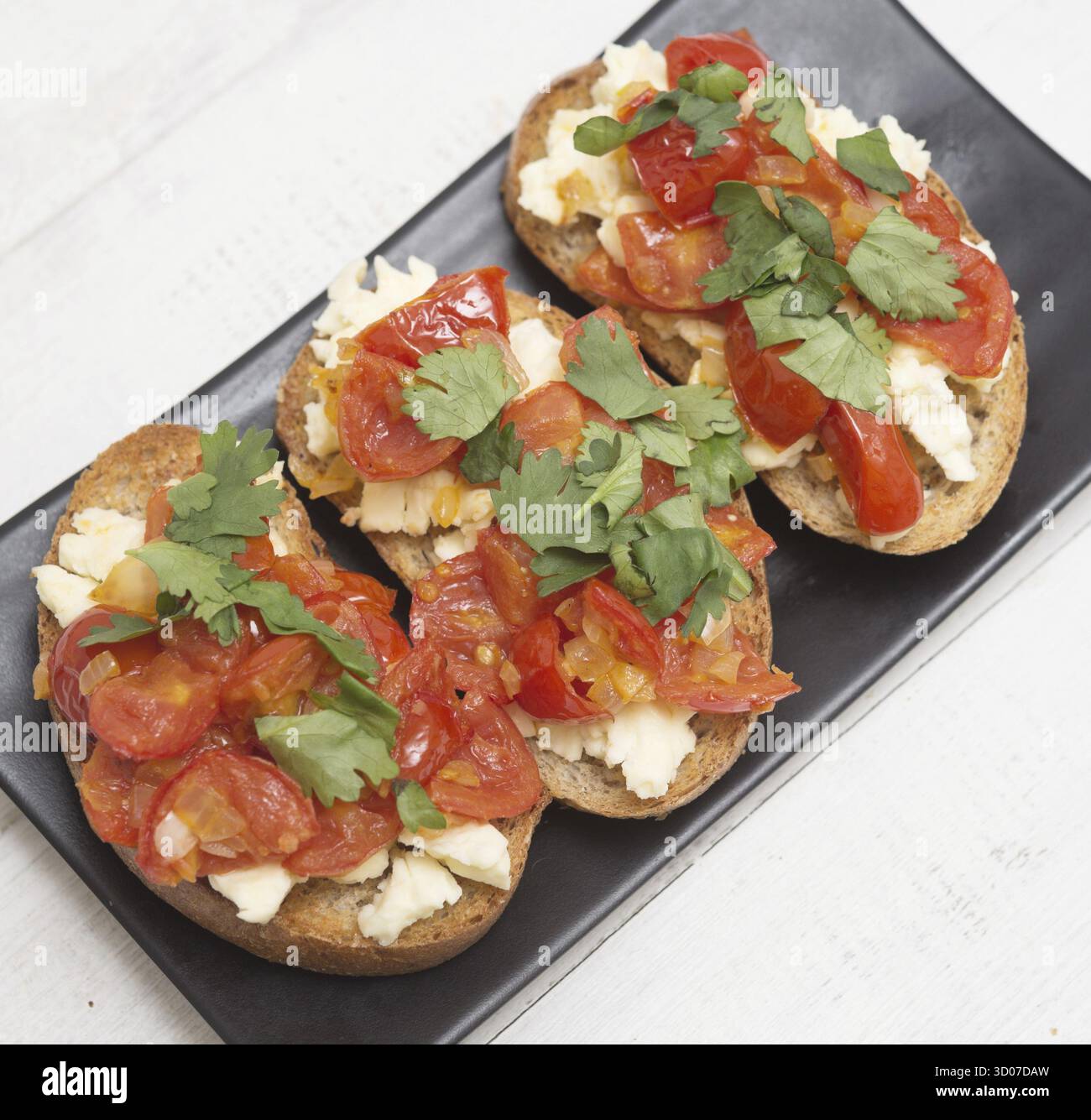 Bruschetta italiana su una piastra Foto Stock