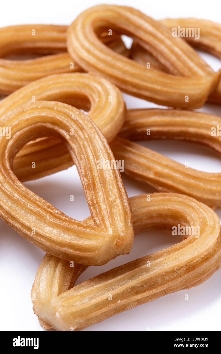 Churros spagnoli tradizionali isolati su sfondo bianco Foto Stock