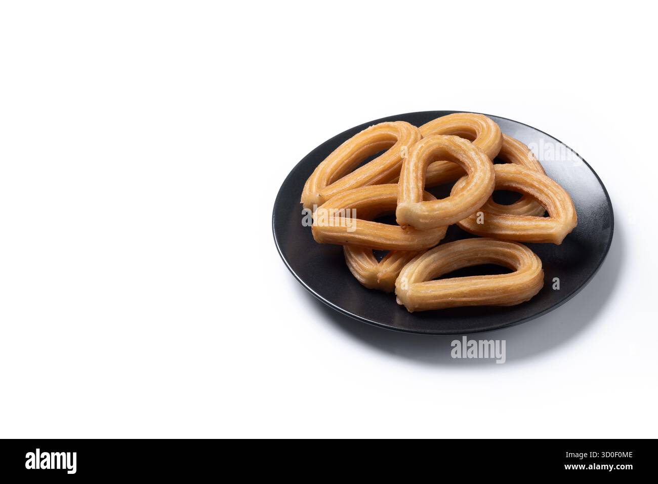 Churros spagnoli tradizionali isolati su sfondo bianco Foto Stock