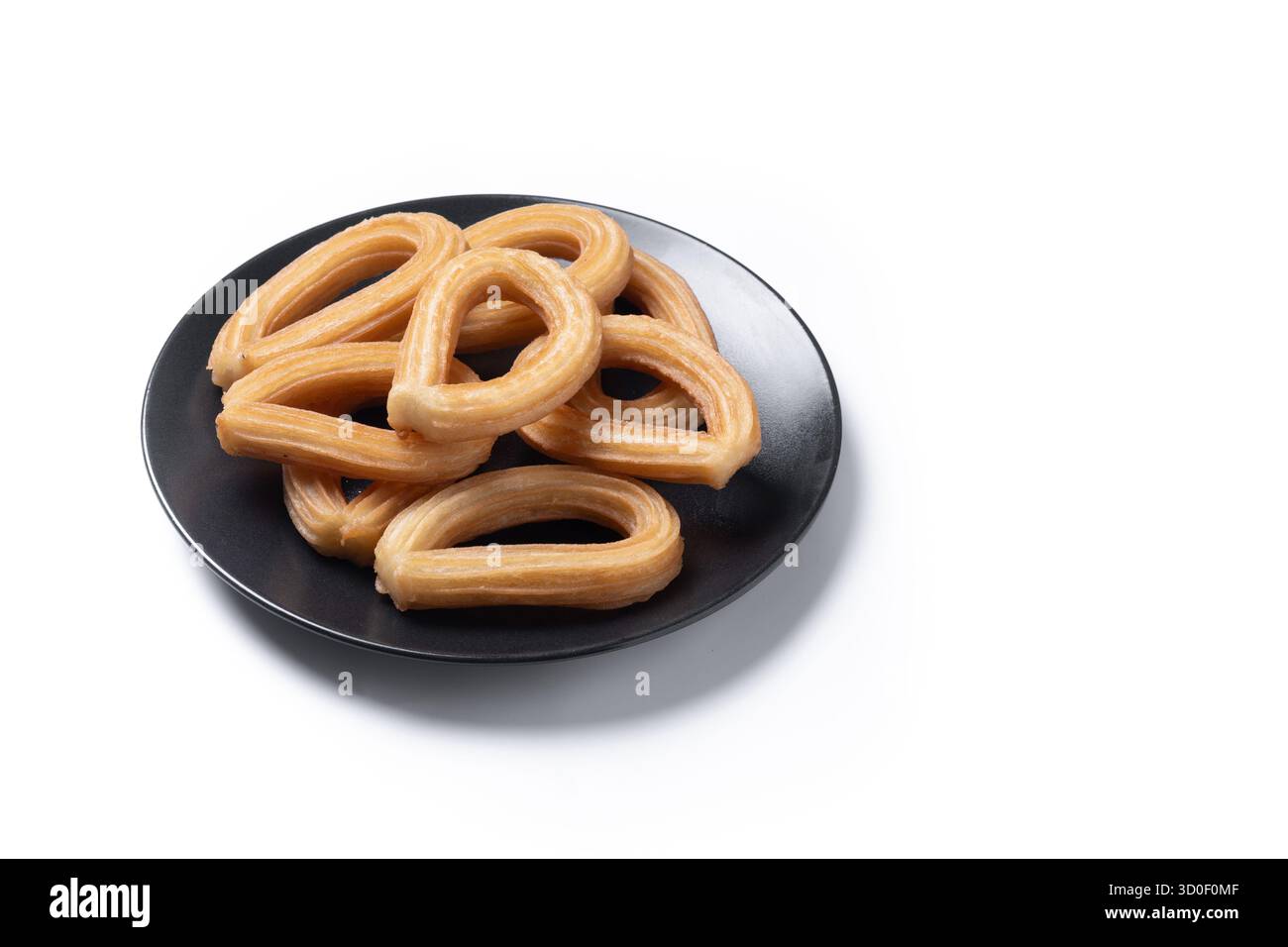 Churros spagnoli tradizionali isolati su sfondo bianco Foto Stock