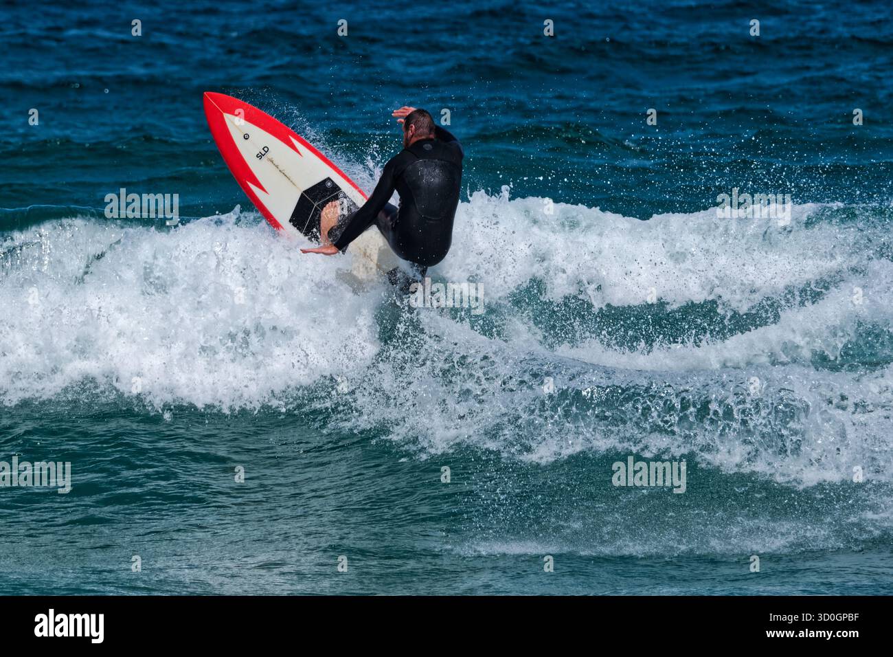Surfista in movimento Foto Stock