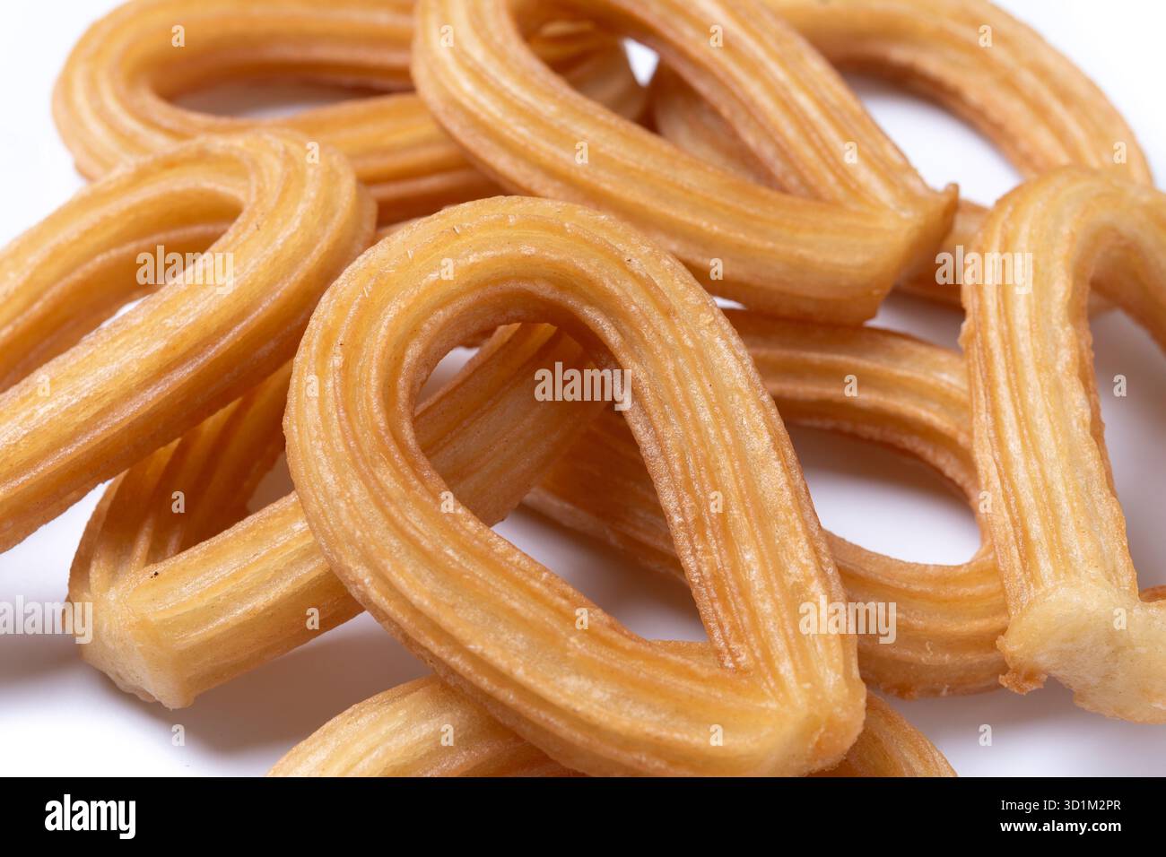 Churros spagnoli tradizionali isolati su sfondo bianco Foto Stock