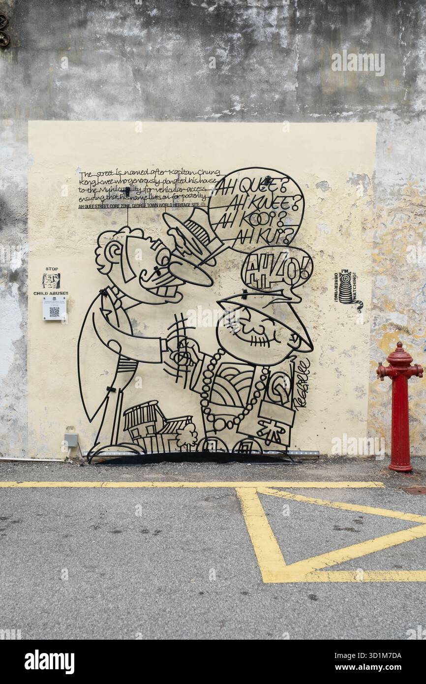 La colorata Street art mostra due personaggi dei cartoni animati che interagiscono contro un muro intemprato in un'area vivace nota per le sue espressioni artistiche. Foto Stock