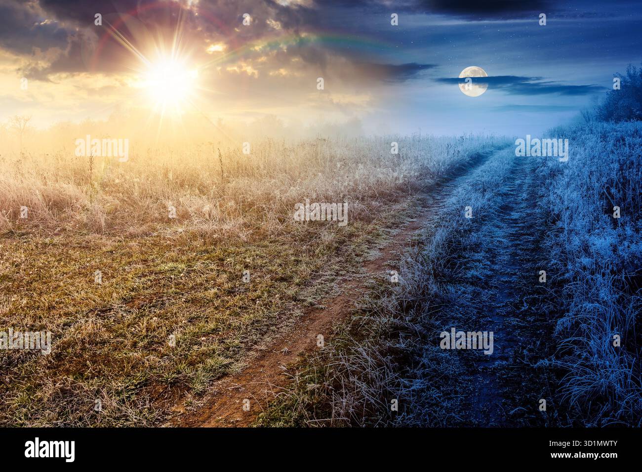 paesaggio autunnale con strade sterrate che attraversano il campo rurale in frenesia e nebbia. concetto di cambiamento di orario diurno e notturno. vista panoramica della campagna montana con Foto Stock