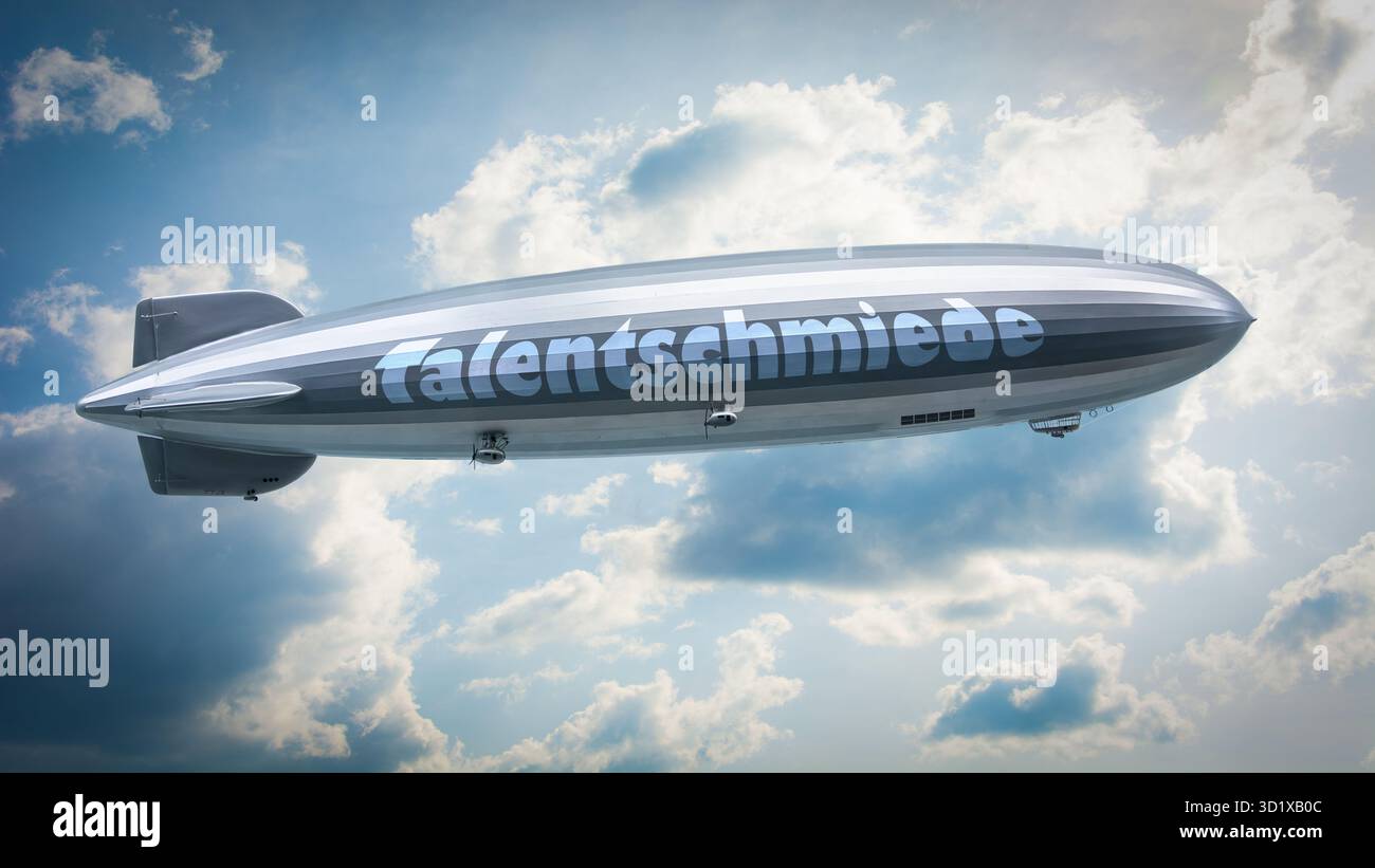 Un'immagine con un cartello in tedesco che punta in direzione della fabbrica di talenti. Foto Stock