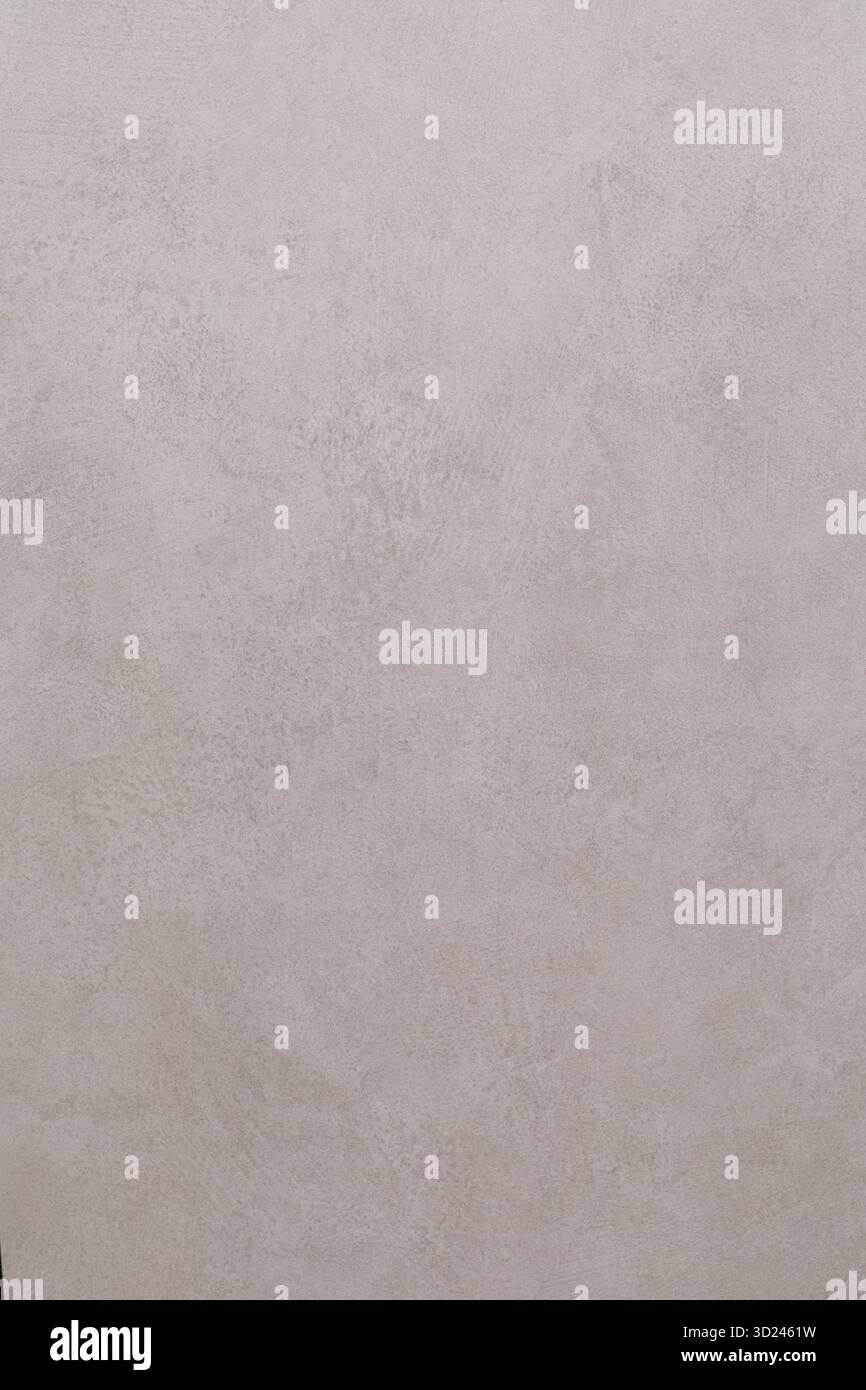 La superficie delle pareti testurizzata con un motivo sottile in tonalità neutre e morbide migliora l'estetica contemporanea degli interni Foto Stock