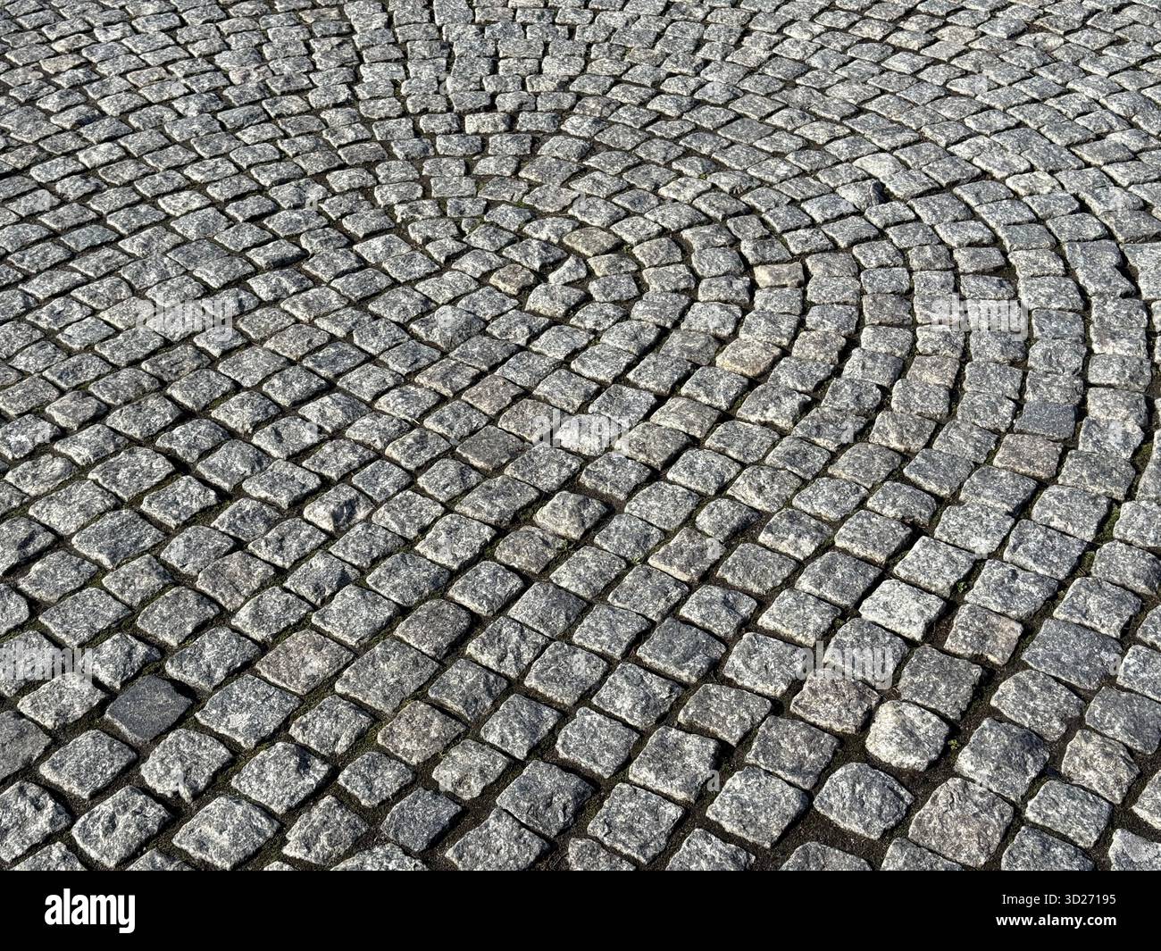 Pavimentazione in ciottoli piastrelle in pietra superficie stradale Foto Stock