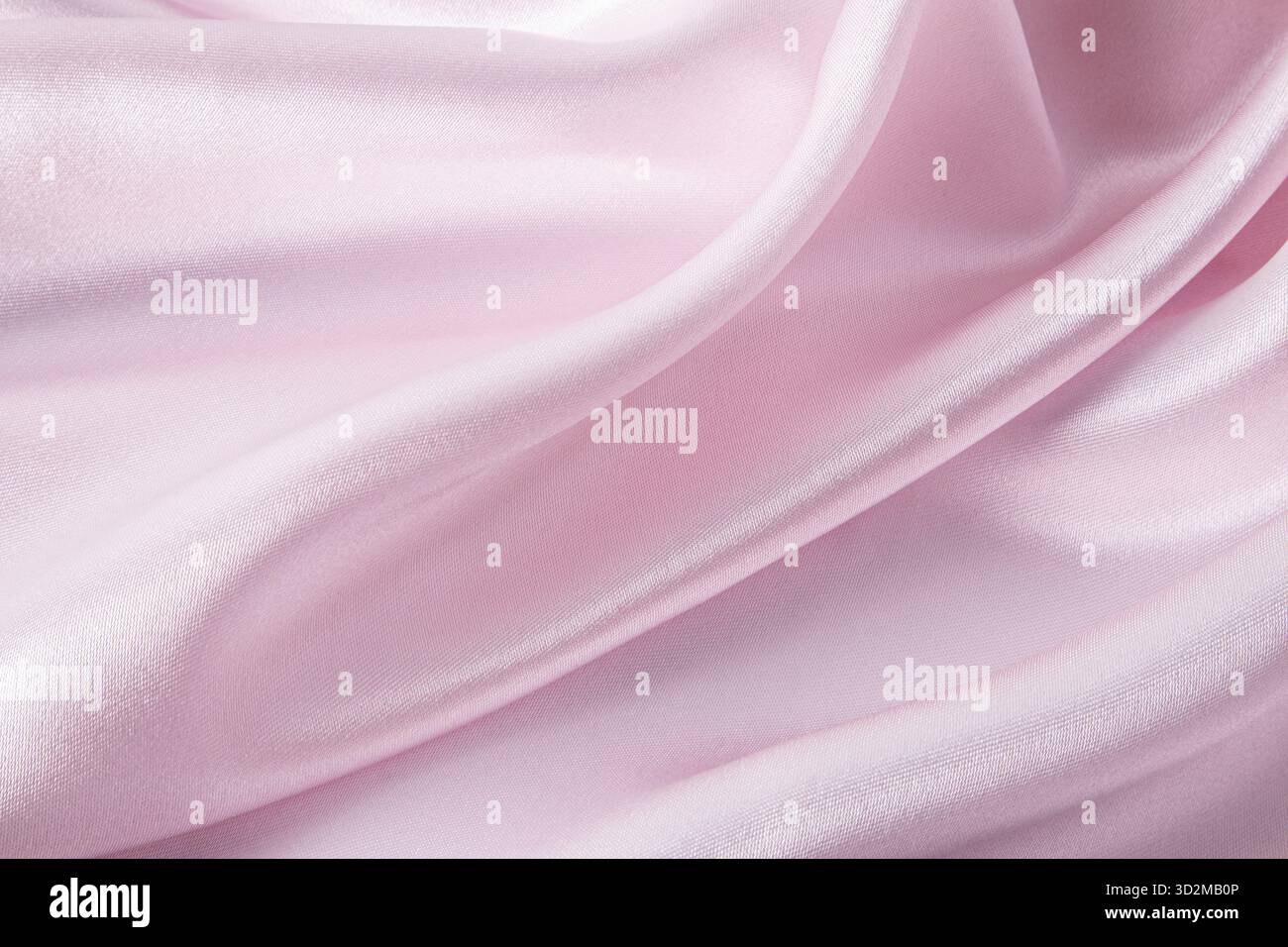 Elegante e delicato sfondo rosa in tessuto satinato. forme d'onda dei tessuti molli. festività, sfondo di nozze. Una copia dello spazio Foto Stock